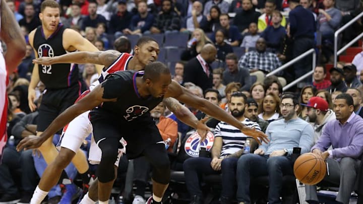 Dec 18, 2016; Washington, DC, USA; Washington Wizards guard Bradley Beal (behind) knocks the ball from LA Clippers forward Luc Mbah a Moute (12) in the first quarter at Verizon Center. Mandatory Credit: Geoff Burke-USA TODAY Sports