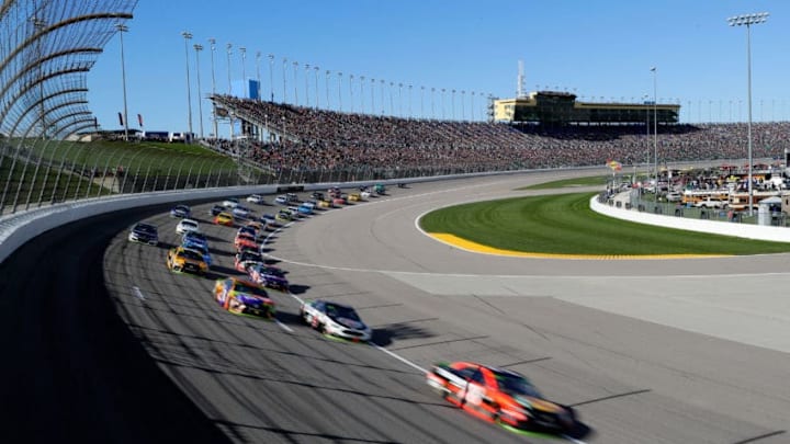 KANSAS CITY, KS - OCTOBER 22: Martin Truex Jr., driver of the #78 Bass Pro Shops/Tracker Boats Toyota, leads a pack of cars during the Monster Energy NASCAR Cup Series Hollywood Casino 400 at Kansas Speedway on October 22, 2017 in Kansas City, Kansas. (Photo by Jamie Squire/Getty Images)