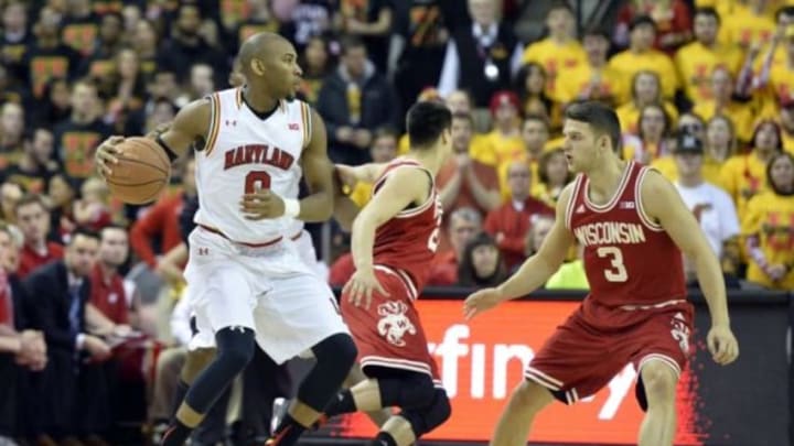 Feb 13, 2016; College Park, MD, USA; Maryland Terrapins guard Rasheed Sulaimon (0) looks to move the ball as Wisconsin Badgers guard Zak Showalter (3) defends during the first half at Xfinity Center. Mandatory Credit: Tommy Gilligan-USA TODAY Sports