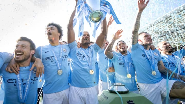 BRIGHTON, ENGLAND - MAY 12: Vincent Kompany of Manchester City lifts the Premier League trophy after the Premier League match between Brighton & Hove Albion and Manchester City at American Express Community Stadium on May 12, 2019 in Brighton, United Kingdom. (Photo by Michael Regan/Getty Images)