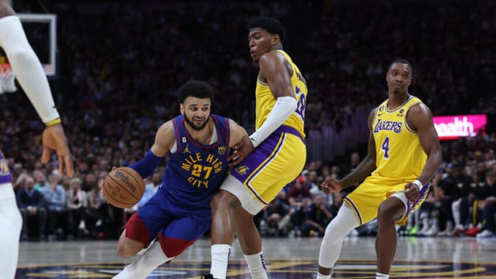DENVER, COLORADO - MAY 16: Jamal Murray #27 of the Denver Nuggets drives to the basket against Rui Hachimura #28 of the Los Angeles Lakers during the fourth quarter in game one of the Western Conference Finals at Ball Arena on May 16, 2023 in Denver, Colorado. NOTE TO USER: User expressly acknowledges and agrees that, by downloading and or using this photograph, User is consenting to the terms and conditions of the Getty Images License Agreement. (Photo by Matthew Stockman/Getty Images)