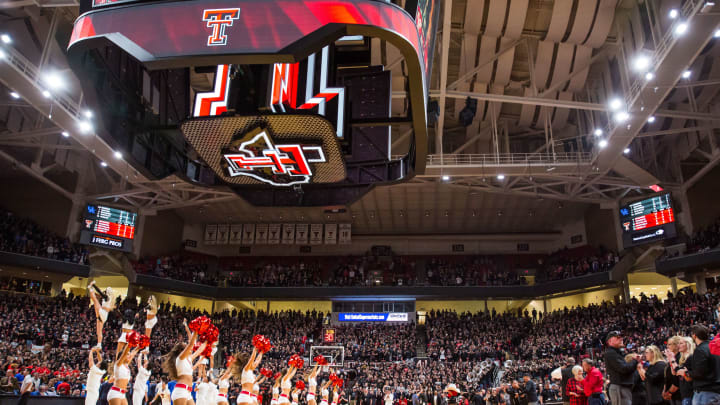 Texas Tech Red Raiders cheerleaders stand on the court during a timeout. (Photo by John E. Moore III/Getty Images)