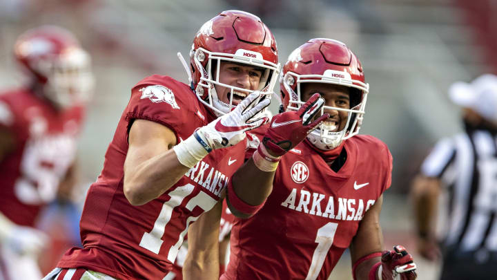 FAYETTEVILLE, AR – OCTOBER 17: Hudson Clark #17 of the Arkansas Razorbacks celebrates with teammate Jalen Catalon #1 after returning a interception for a touchdown in the second of a game against the Mississippi Rebels at Razorback Stadium on October 17, 2020 in Fayetteville, Arkansas. (Photo by Wesley Hitt/Getty Images)