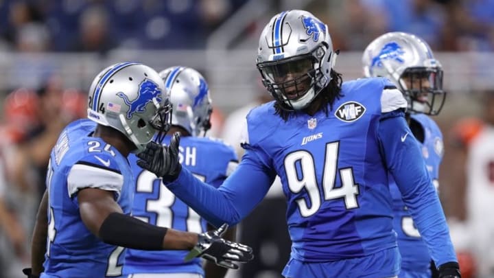 Aug 18, 2016; Detroit, MI, USA; Detroit Lions defensive end Ezekiel Ansah (94) greets cornerback Nevin Lawson (24) during the first quarter against the Cincinnati Bengals at Ford Field. Mandatory Credit: Raj Mehta-USA TODAY Sports