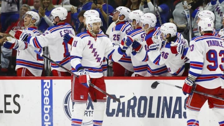 Mar 31, 2016; Raleigh, NC, USA; New York Rangers forward Rick Nash (61) celebrates with teammates after scoring a goal in the second period against the Carolina Hurricanes at PNC Arena. Mandatory Credit: James Guillory-USA TODAY Sports