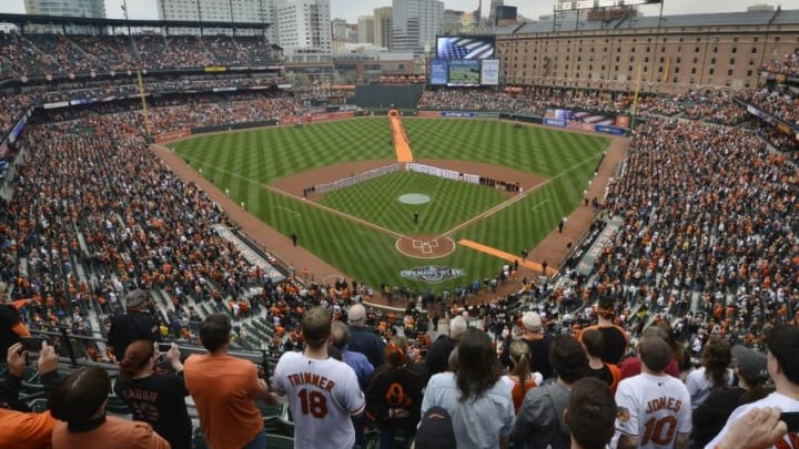 Apr 4, 2016; Baltimore, MD, USA; Baseball fans stand during the signing of the National Anthem before the game between the Baltimore Orioles and the Minnesota Twins at Oriole Park at Camden Yards. Mandatory Credit: Tommy Gilligan-USA TODAY Sports