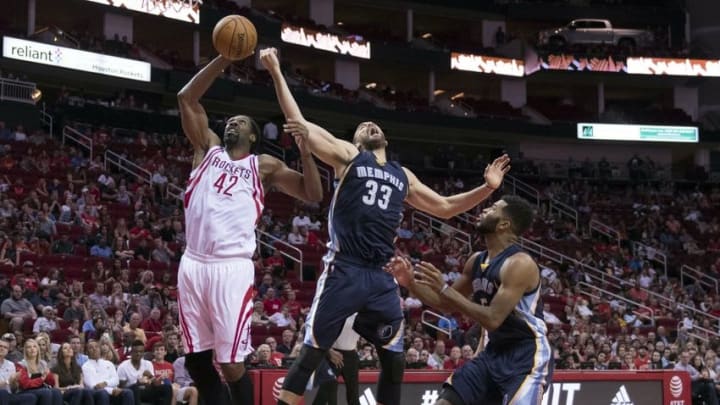 Oct 15, 2016; Houston, TX, USA; Houston Rockets center Nene Hilario (42) grabs a rebound in front of Memphis Grizzlies center Marc Gasol (33) during the second quarter at the Toyota Center. Mandatory Credit: Jerome Miron-USA TODAY Sports