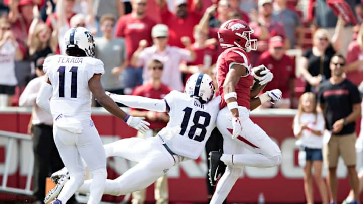 FAYETTEVILLE, AR - SEPTEMBER 9: Jonathan Nance #7 of the Arkansas Razorbacks scores a touchdown after catching a pass in front of Nick Orr #18 of the TCU Horned Frogs at Donald W. Reynolds Razorback Stadium on September 9, 2017 in Fayetteville, Arkansas. (Photo by Wesley Hitt/Getty Images)