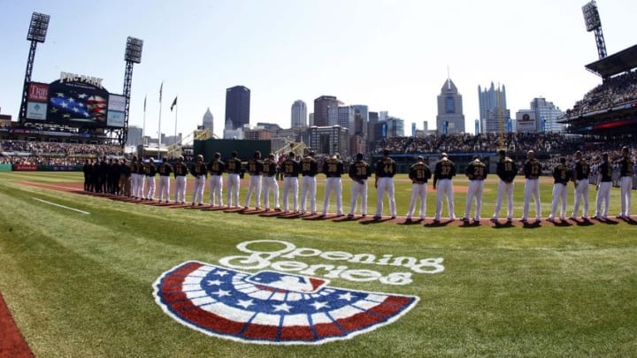 Mar 31, 2014; Pittsburgh, PA, USA; The Pittsburgh Pirates stand for the national anthem prior to the first inning of an opening day baseball game against the Chicago Cubs at PNC Park. Mandatory Credit: Charles LeClaire-USA TODAY Sports