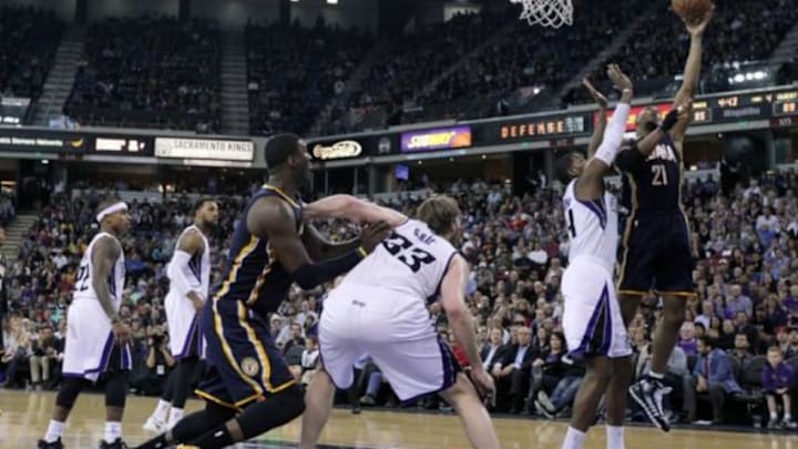 Jan 24, 2014; Sacramento, CA, USA; Indiana Pacers forward David West (21) shoots in front of Sacramento Kings forward Jason Thompson (34) in the second half of their NBA basketball game at Sleep Train Arena. Mandatory Credit: Lance Iversen-USA TODAY Sports