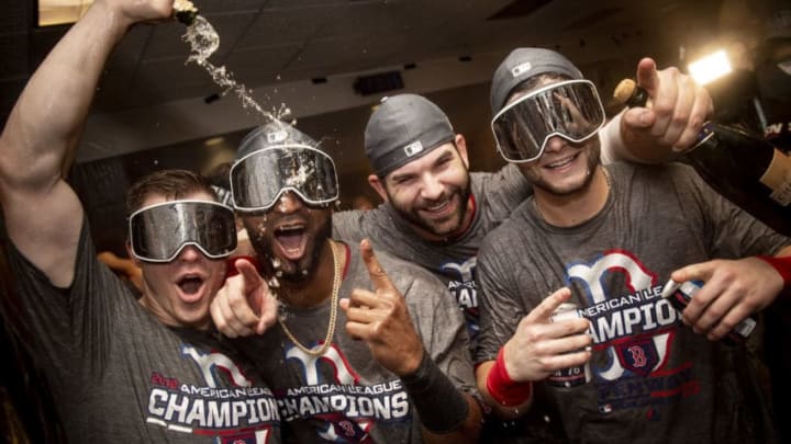 HOUSTON, TX - OCTOBER 18: Brock Holt #12, Eduardo Nunez #36, Mitch Moreland #18, and Andrew Benintendi #16of the Boston Red Sox celebrate with champagne in the clubhouse after clinching the American League Championship Series in game five against the Houston Astros on October 18, 2018 at Minute Maid Park in Houston, Texas. (Photo by Billie Weiss/Boston Red Sox/Getty Images)