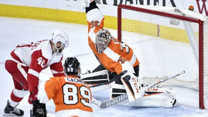 Mar 15, 2016; Philadelphia, PA, USA; Philadelphia Flyers goalie Steve Mason (35) makes a save against Detroit Red Wings left wing Henrik Zetterberg (40) during the third period at Wells Fargo Center. The Flyers defeated the Red Wings, 4-3. Mandatory Credit: Eric Hartline-USA TODAY Sports
