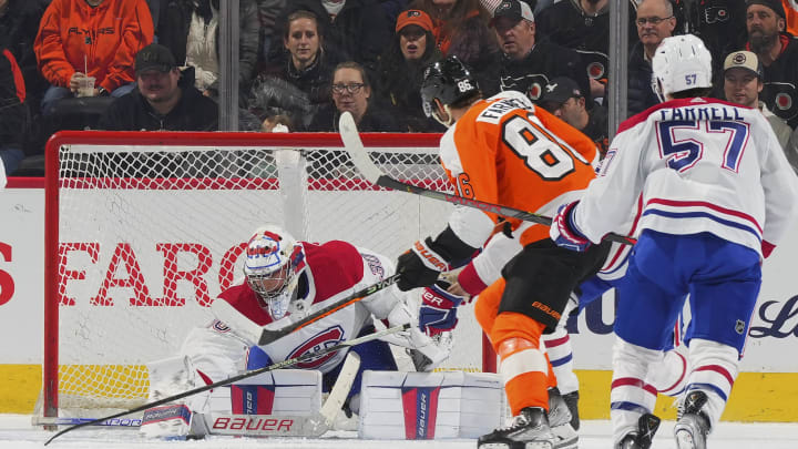 Cayden Primeau #30 of the Montreal Canadiens makes a save in front of Joel Farabee #86 of the Philadelphia Flyers