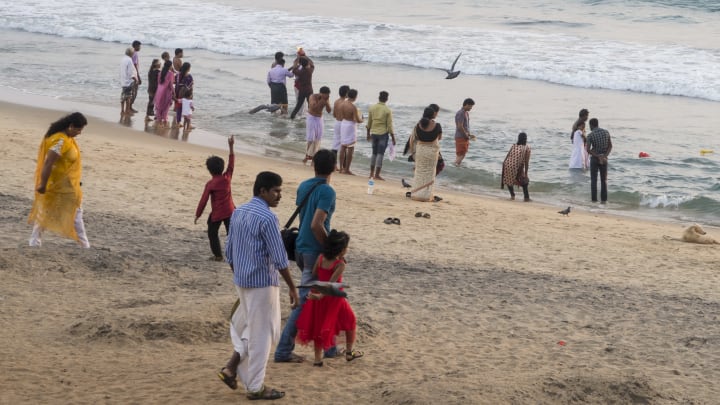 VARKALA, INDIA – DECEMBER 21: Locals, fishermen, gurus and tourists spend their holidays at the beach on December 21, 2014 in Varkala, Kerala, India (Photo by EyesWideOpen/Getty Images)