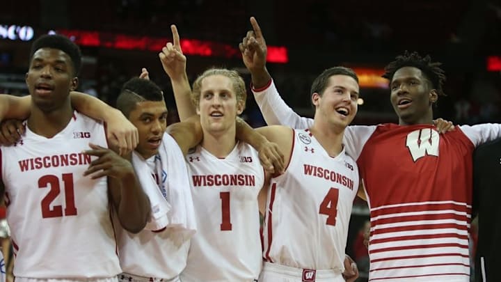 Nov 11, 2016; Madison, WI, USA; Members of the Wisconsin Badgers basketball team celebrate their win against the Central Arkansas Bears by singing the school song "Varsity" at the Kohl Center. Wisconsin defeated Central Arkansas 79-47. Mandatory Credit: Mary Langenfeld-USA TODAY Sports