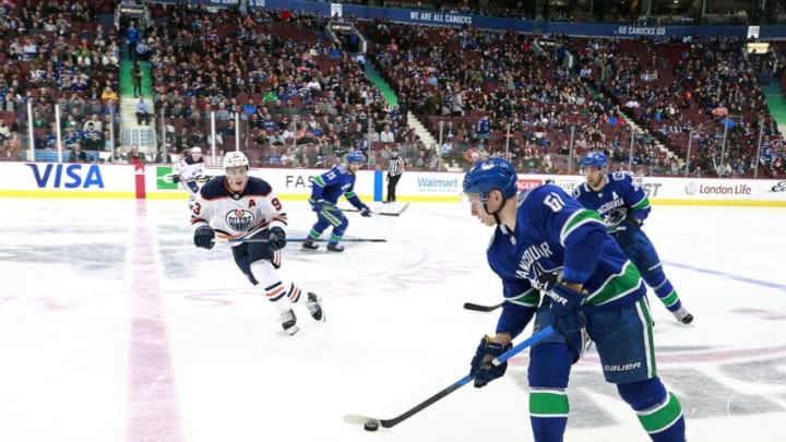 VANCOUVER, BC - MARCH 29: Ryan Nugent-Hopkins #93 of the Edmonton Oilers looks on as Troy Stecher #51 of the Vancouver Canucks skates up ice during their NHL game at Rogers Arena March 29, 2018 in Vancouver, British Columbia, Canada. (Photo by Jeff Vinnick/NHLI via Getty Images)"n