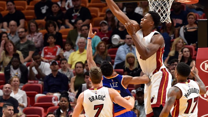 Mar 31, 2017; Miami, FL, USA; Miami Heat center Hassan Whiteside (21) blocks a shot by New York Knicks guard Courtney Lee (5) during the second half at American Airlines Arena. Mandatory Credit: Steve Mitchell-USA TODAY Sports