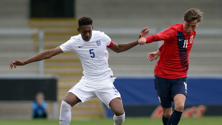 BURTON UPON TRENT, ENGLAND - MARCH 21: Reece Oxford (L) of England and Andreas Helmersen of Norway battle for the ball during the U17 Euro Elite Qualifying Round match between England and Norway at the Pirelli Stadium on March 21, 2015 in Burton upon Trent, England. (Photo by Clint Hughes/Getty Images)