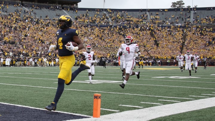 ANN ARBOR, MICHIGAN – SEPTEMBER 28: Nico Collins #4 of the Michigan Wolverines scores a first quarter touchdown while playing the Rutgers Scarlet Knights at Michigan Stadium on September 28, 2019 in Ann Arbor, Michigan. (Photo by Gregory Shamus/Getty Images)