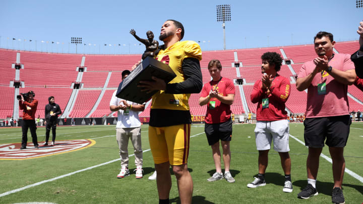 Apr 15, 2023; Los Angeles, CA, USA; USC Trojans quarterback Caleb Williams (13) holds the Heisman Trophy during the Spring Game at Los Angeles Memorial Coliseum. Mandatory Credit: Kiyoshi Mio-USA TODAY Sports