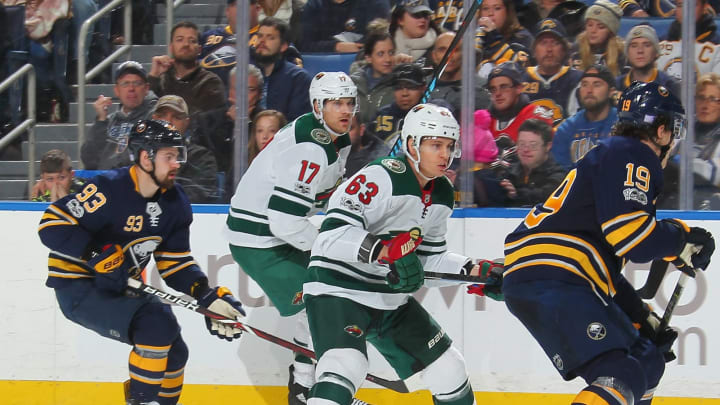 BUFFALO, NY - NOVEMBER 22: Marcus Foligno #17 and Tyler Ennis #63 of the Minnesota Wild skate against Jake McCabe #19 and Victor Antipin #93 of the Buffalo Sabres during an NHL game on November 22, 2017 at KeyBank Center in Buffalo, New York. (Photo by Bill Wippert/NHLI via Getty Images)