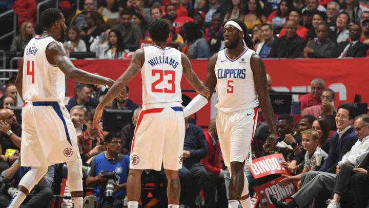LOS ANGELES, CA - APRIL 10: JaMychal Green #4, Lou Williams #23 and Montrezl Harrell #5 of the LA Clippers hi-five during the game against the Utah Jazz on April 10, 2019 at STAPLES Center in Los Angeles, California. NOTE TO USER: User expressly acknowledges and agrees that, by downloading and/or using this photograph, user is consenting to the terms and conditions of the Getty Images License Agreement. Mandatory Copyright Notice: Copyright 2019 NBAE (Photo by Andrew D. Bernstein/NBAE via Getty Images)