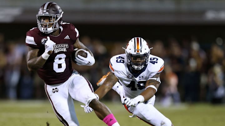 STARKVILLE, MS - OCTOBER 06: Kylin Hill #8 of the Mississippi State Bulldogs runs with the ball as Darrell Williams #49 of the Auburn Tigers defends during the first half at Davis Wade Stadium on October 6, 2018 in Starkville, Mississippi. (Photo by Jonathan Bachman/Getty Images) STARKVILLE, MS - OCTOBER 06: Kylin Hill #8 of the Mississippi State Bulldogs runs with the ball as Darrell Williams #49 of the Auburn Tigers defends during the first half at Davis Wade Stadium on October 6, 2018 in Starkville, Mississippi. (Photo by Jonathan Bachman/Getty Images)