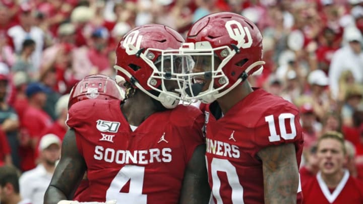 NORMAN, OK - SEPTEMBER 28: Running back Trey Sermon #4 and wide receiver Theo Wease #10 of the Oklahoma Sooners celebrate a touchdown against the Texas Tech Red Raiders at Gaylord Family Oklahoma Memorial Stadium on September 28, 2019 in Norman, Oklahoma. The Sooners defeated the Red Raiders 55-16. (Photo by Brett Deering/Getty Images)