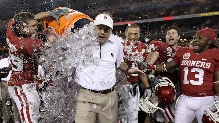 GLENDALE, AZ – JANUARY 01: Head coach Bob Stoops has a Gatorade bucket dumped on him by Eric Mensik