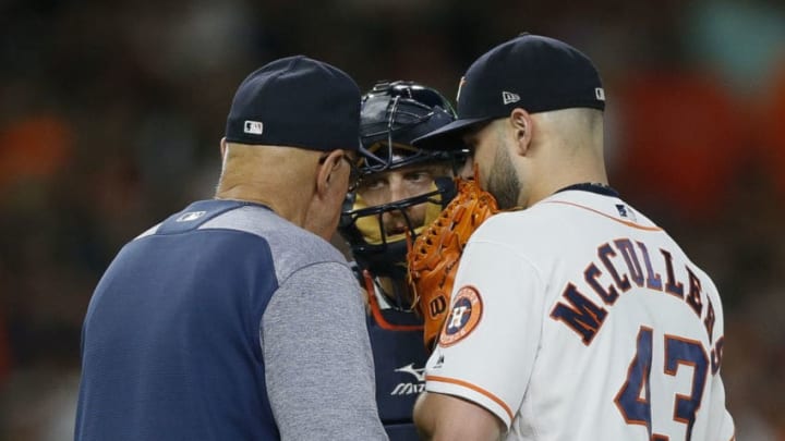 HOUSTON, TX - JULY 11: Houston Astros pitching coach Brent Strom #56 talks with Lance McCullers Jr. #43 snd Tim Federowicz #19 in the third inning against the Oakland Athletics at Minute Maid Park on July 11, 2018 in Houston, Texas. (Photo by Bob Levey/Getty Images)
