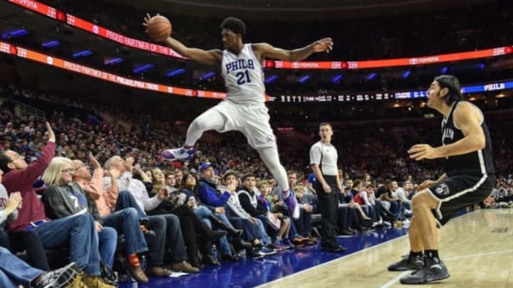 Dec 18, 2016; Philadelphia 76ers center Joel Embiid dives to keep the ball in play during the fourth quarter of the game against the Brooklyn Nets at the Wells Fargo Center. The Sixers won the game 108-107.Mandatory Credit: John Geliebter-USA TODAY Sports