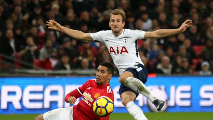 LONDON, ENGLAND - JANUARY 31: Harry Kane of Tottenham Hotspur shoots as Chris Smalling of Manchester United attempts to block during the Premier League match between Tottenham Hotspur and Manchester United at Wembley Stadium on January 31, 2018 in London, England. (Photo by Steve Bardens/Getty Images)