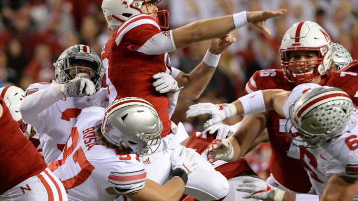 LINCOLN, NE - OCTOBER 14: Quarterback Tanner Lee #13 of the Nebraska Cornhuskers throws under pressure from defensive lineman Nick Bosa #97 of the Ohio State Buckeyes at Memorial Stadium on October 14, 2017 in Lincoln, Nebraska. (Photo by Steven Branscombe/Getty Images)