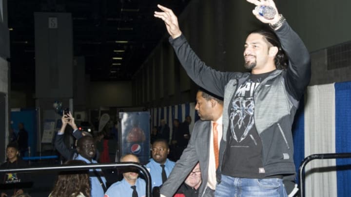 WASHINGTON, DC - JANUARY 28: WWE Wrestler Roman Reigns signs autographs during the Washington Auto Show at the Washington Convention Center in Washington DC on January 28, 2016. (Kris Connor/Getty Images)
