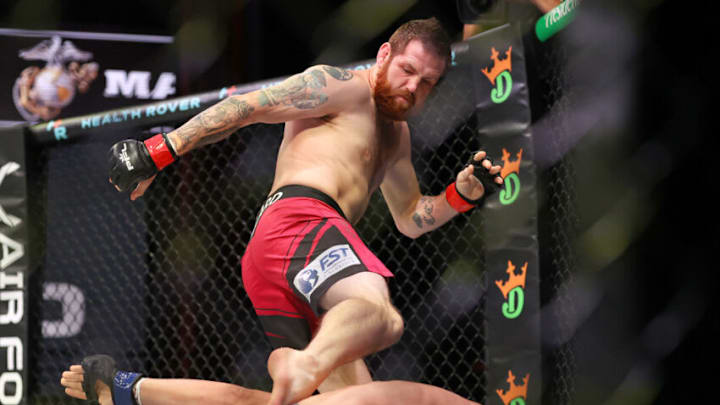 ATLANTIC CITY, NEW JERSEY - JUNE 10: Clay Collard of the United States kicks Joilton Lutterbach of Germany during the lightweight bout in Ovation Hall at Ocean Casino Resort on June 10, 2021 in Atlantic City, New Jersey. (Photo by Elsa/Getty Images)
