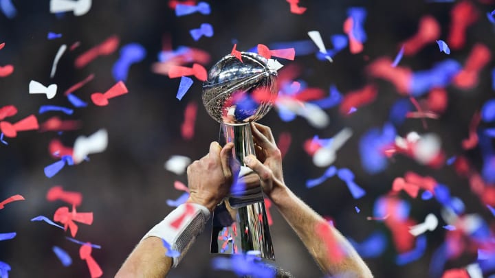 Feb 5, 2017; Houston, TX, USA; View of the the Lombardi Trophy as New England Patriots quarterback Tom Brady (12) holds it up after defeating the Atlanta Falcons during Super Bowl LI at NRG Stadium. The Patriots won 34-28. Mandatory Credit: Bob Donnan-USA TODAY Sports