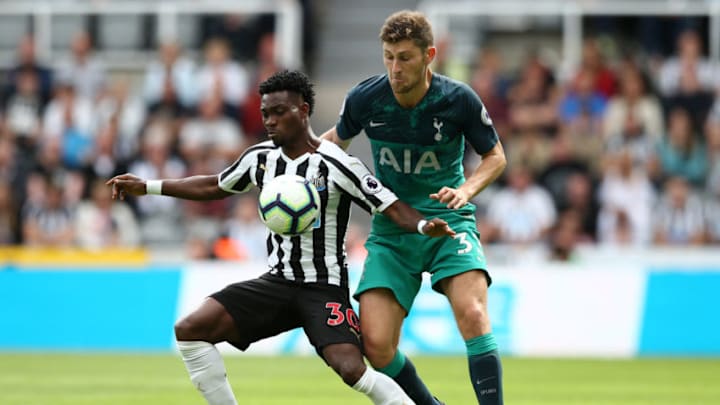 NEWCASTLE UPON TYNE, ENGLAND - AUGUST 11: Christian Atsu of Newcastle United is challenged by Ben Davies of Tottenham Hotspur during the Premier League match between Newcastle United and Tottenham Hotspur at St. James Park on August 11, 2018 in Newcastle upon Tyne, United Kingdom. (Photo by Jan Kruger/Getty Images)
