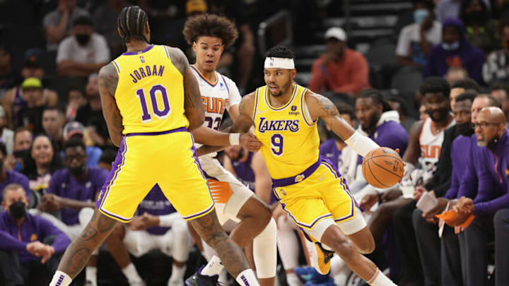 PHOENIX, ARIZONA - OCTOBER 06: Wesley Matthews #9 of the Los Angeles Lakers handles the ball ahead of Cameron Johnson #23 of the Phoenix Suns during the NBA preseason game at Footprint Center on October 06, 2021 in Phoenix, Arizona. The Suns defeated the Lakers 117-105. NOTE TO USER: User expressly acknowledges and agrees that, by downloading and or using this photograph, User is consenting to the terms and conditions of the Getty Images License Agreement. (Photo by Christian Petersen/Getty Images) PHOENIX, ARIZONA - OCTOBER 06: Wesley Matthews #9 of the Los Angeles Lakers handles the ball ahead of Cameron Johnson #23 of the Phoenix Suns during the NBA preseason game at Footprint Center on October 06, 2021 in Phoenix, Arizona. The Suns defeated the Lakers 117-105. NOTE TO USER: User expressly acknowledges and agrees that, by downloading and or using this photograph, User is consenting to the terms and conditions of the Getty Images License Agreement. (Photo by Christian Petersen/Getty Images)