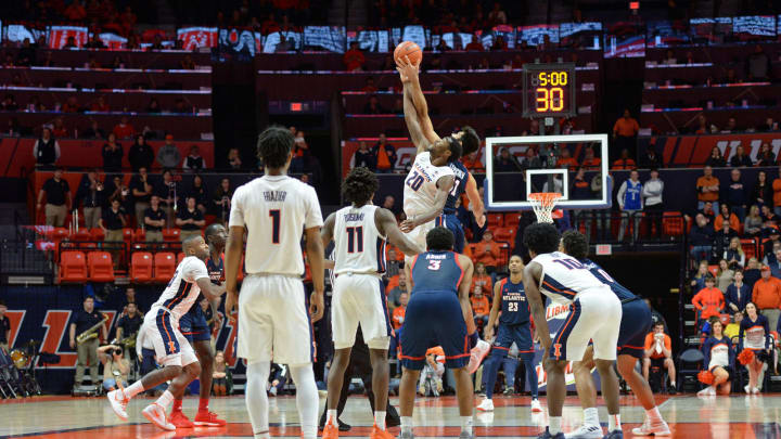 CHAMPAIGN, IL – DECEMBER 29: Illinois Fighting Illini guard Da’Monte Williams (20) tips off against FAU Owls forward Simeon Lepichev (21) to start overtime during the college basketball game between the Florida Atlantic University Owls and the Illinois Fighting Illini on December 29, 2018, at the State Farm Center in Champaign, Illinois. (Photo by Michael Allio/Icon Sportswire via Getty Images)