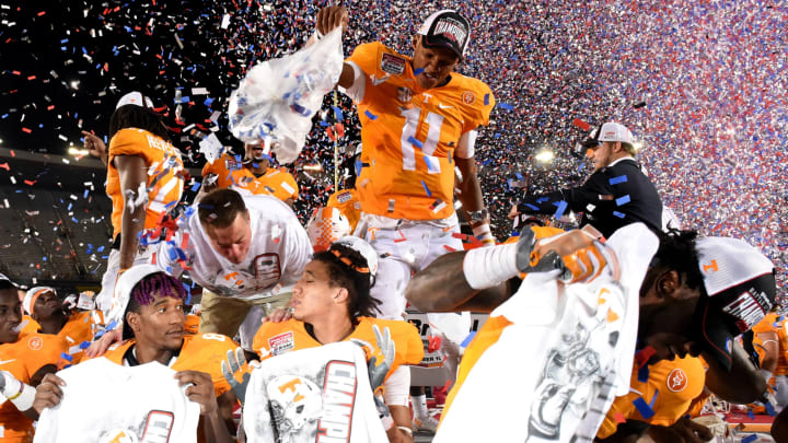Tennessee quarterback Joshua Dobbs (11) dumps confetti over his Tennessee teammates as they celebrate their 45-24 win over Virginia Tech at The Battle At Bristol Sunday, September 11, 2016 in Bristol, Tenn.Dobbs Battle At Bristol 2016