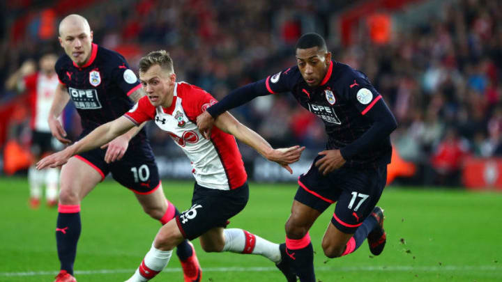 SOUTHAMPTON, ENGLAND - DECEMBER 23: James Ward-Prowse of Southampton battles for possesion with Rajiv van La Parra of Huddersfield Town during the Premier League match between Southampton and Huddersfield Town at St Mary's Stadium on December 23, 2017 in Southampton, England. (Photo by Clive Rose/Getty Images)