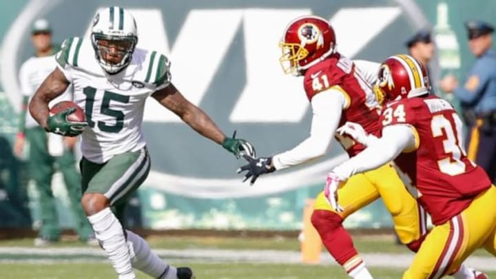 Oct 18, 2015; East Rutherford, NJ, USA; New York Jets wide receiver Brandon Marshall (15) carries the ball as Washington Redskins cornerback Will Blackmon (41) chases in the second quarter against the Washington Redskins at MetLife Stadium. Mandatory Credit: Vincent Carchietta-USA TODAY Sports