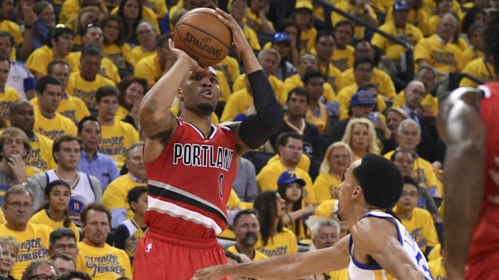 May 11, 2016; Oakland, CA, USA; Portland Trail Blazers guard Damian Lillard (0) shoots the basketball against Golden State Warriors guard Shaun Livingston (34) during the second quarter in game five of the second round of the NBA Playoffs at Oracle Arena. Mandatory Credit: Kyle Terada-USA TODAY Sports