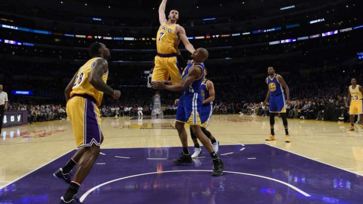 Nov 4, 2016; Los Angeles, CA, USA; Los Angeles Lakers forward Larry Nance Jr. (7) dunks the ball on Golden State Warriors forward David West (3) during the second quarter at Staples Center. Mandatory Credit: Kelvin Kuo-USA TODAY Sports