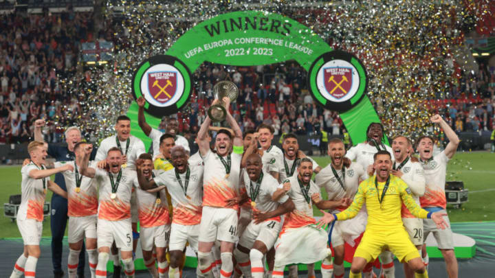 PRAGUE, CZECH REPUBLIC - JUNE 07: Declan Rice of West Ham United lifts the Winners' trophy as he celebrates with team mates on the podium following the UEFA Europa Conference League 2022/23 final match between ACF Fiorentina and West Ham United FC at Eden Arena on June 07, 2023 in Prague, Czech Republic. (Photo by Jonathan Moscrop/Getty Images)