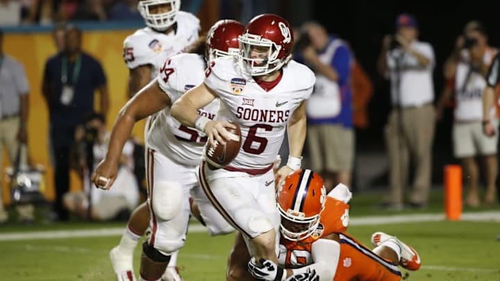 Dec 31, 2015; Miami Gardens, FL, USA; Oklahoma Sooners quarterback Baker Mayfield (6) is sacked by Clemson Tigers defensive end Kevin Dodd (98) in the third quarter of the 2015 CFP Semifinal at the Orange Bowl at Sun Life Stadium. Mandatory Credit: Kim Klement-USA TODAY Sports