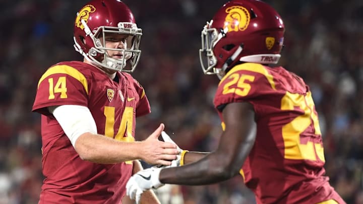 LOS ANGELES, CA - OCTOBER 27: Quarterback Sam Darnold #14 of the USC Trojans celebrates the touchdown of running back Ronald Jones II #25 to take a 14-0 lead over the California Golden Bears during the first quarter at Los Angeles Coliseum on October 27, 2016 in Los Angeles, California. (Photo by Harry How/Getty Images)