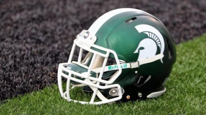 Sep 4, 2015; Kalamazoo, MI, USA; General view of Michigan State Spartans helmet on field prior to a game against Western Michigan at Waldo Stadium. Mandatory Credit: Mike Carter-USA TODAY Sports