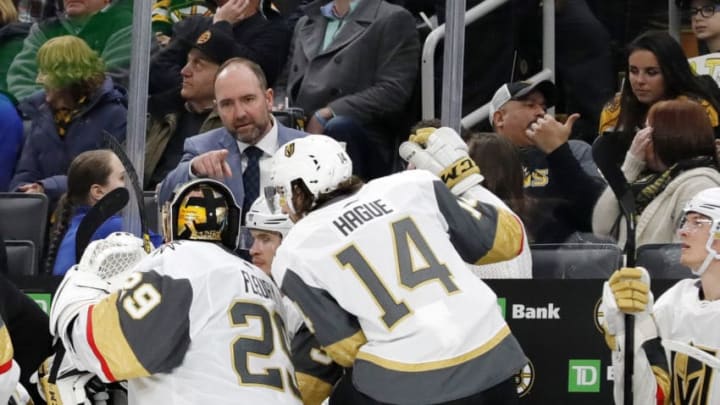 BOSTON, MA - JANUARY 21: Vegas Golden Knights head coach Pete DeBoer discusses strategy with Vegas Golden Knights goalie Marc-Andre Fleury (29) and Vegas Golden Knights defenseman Nicolas Hague (14) during a game between the Boston Bruins and the Vegas Golden Knights on January 21, 2020, at TD Garden in Boston, Massachusetts. (Photo by Fred Kfoury III/Icon Sportswire via Getty Images)