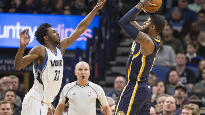 Jan 26, 2017; Minneapolis, MN, USA; Indiana Pacers forward Paul George (13) shoots the ball over Minnesota Timberwolves forward Andrew Wiggins (22) in the second half at Target Center. The Pacers won 109-103. Mandatory Credit: Jesse Johnson-USA TODAY Sports